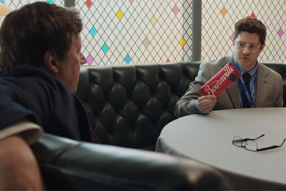 Man holding bar of Bournville