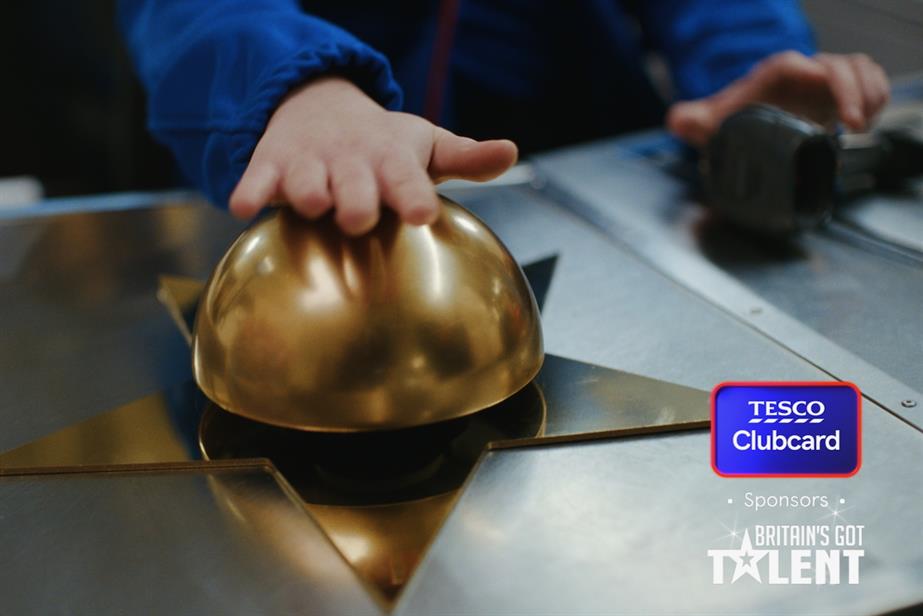 A Tesco Clubcard ad till: a cashier smashes a Britain's Got Talent golden buzzer